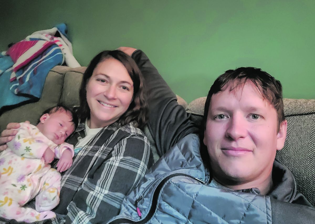 Edward Alexander (right), his wife, Alison, and their daughter, Madison Grace.