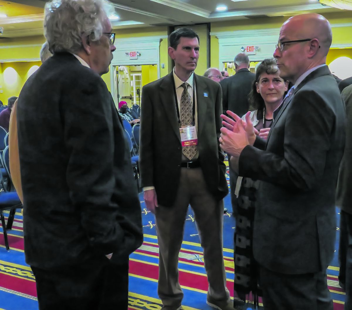 Ty Seidule talking with Paul Ellis Graham, Chris Burn, of ground; the Peach Orchard, Elaine Henderson.