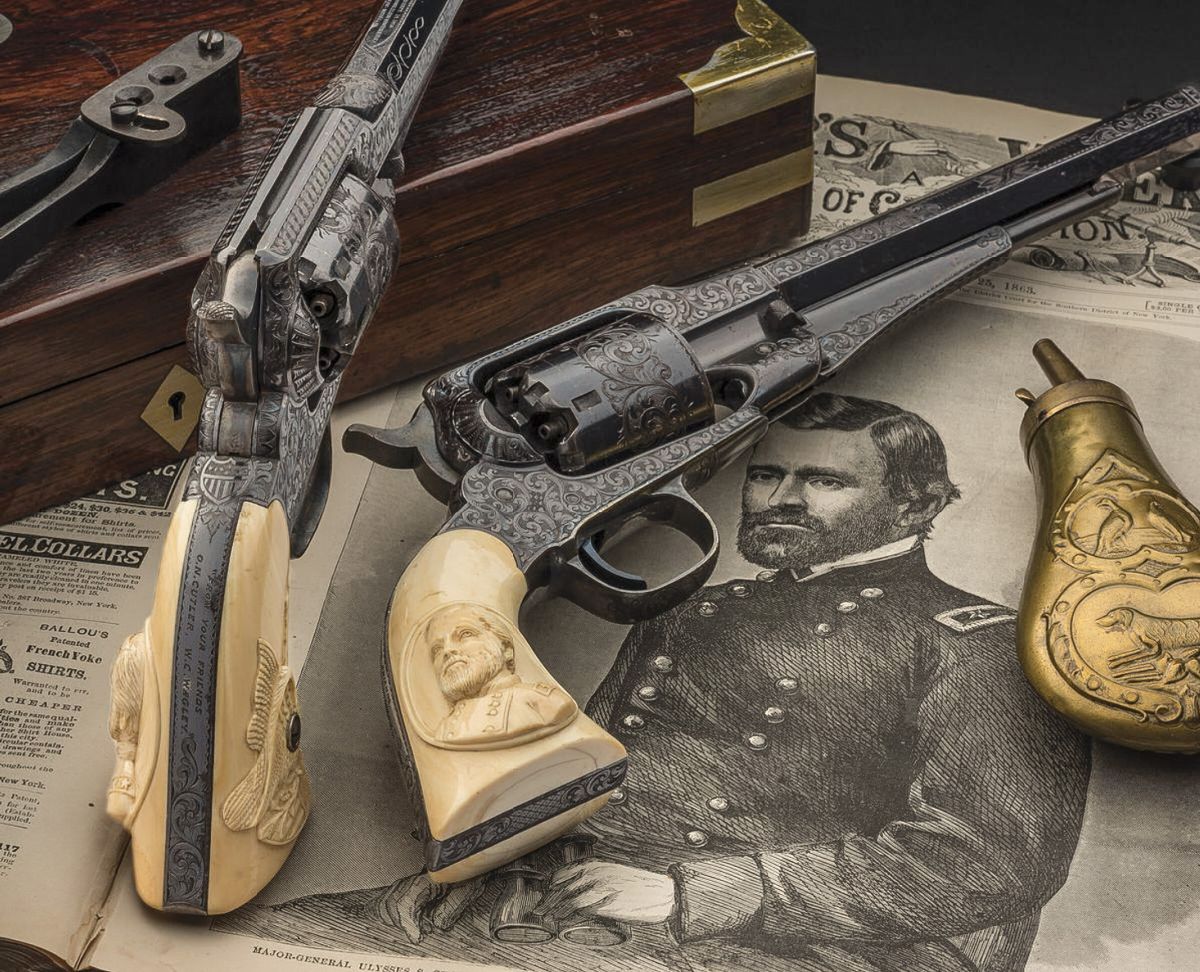 The deluxe rosewood presentation case has a blank lid escutcheon, pheasant and dog pattern powder flask with sloped charger, oiler, blued ball/bullet mold, L-shaped combination tool, cleaning rod, key, and Eley Bros. cap tin.