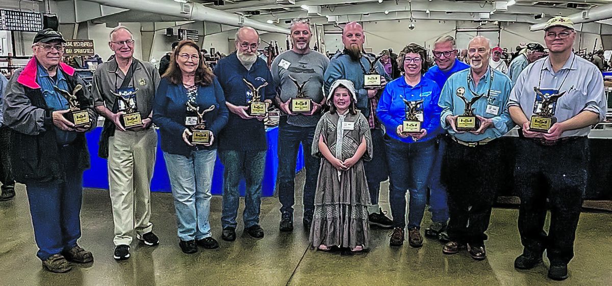 Award winners in order L to R: Matt Switlik, Richard Wolfe, Elizabeth Topping, Ray Zielin, Phil McCoy, Bret Schweinfurth, Cathy and Mark Spencer, Chuck Baylis, and Bill Combs. (Kayley Boettner)
