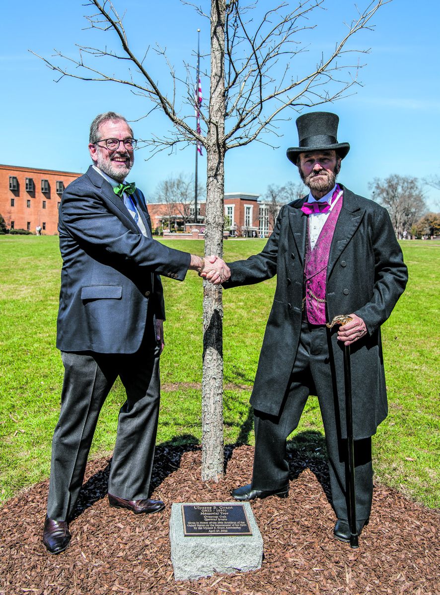 Ulysses Dietz shaking hands with President Grant (Dr. Curt Fields) at the newly planted and dedicated Grant Oak Tree on the Drill Field at Mississippi State University. (Mississippi State University by Diana Janus)