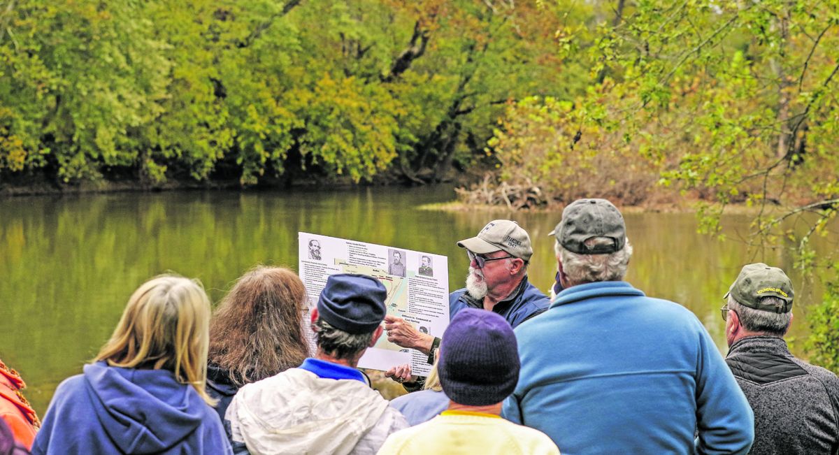Don Hakenson, another co-leader of the Both Sides Tours, points out key elements of the battle on an enlarged map.