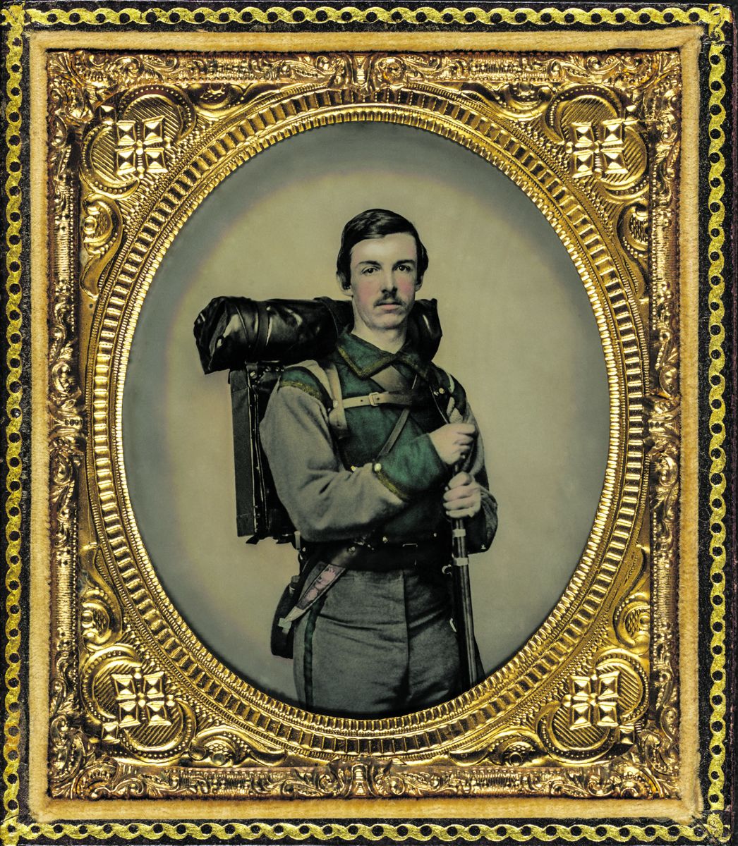 Unidentified soldier in Confederate uniform of Company E, “Lynchburg Rifles,” 11th Virginia Infantry Volunteers holding 1841 “Mississippi” rifle, Sheffield-type Bowie knife, canteen, box knapsack, blanket roll, and cartridge box. Charles R. Rees, photographer. Liljenquist Family collection (Library of Congress).