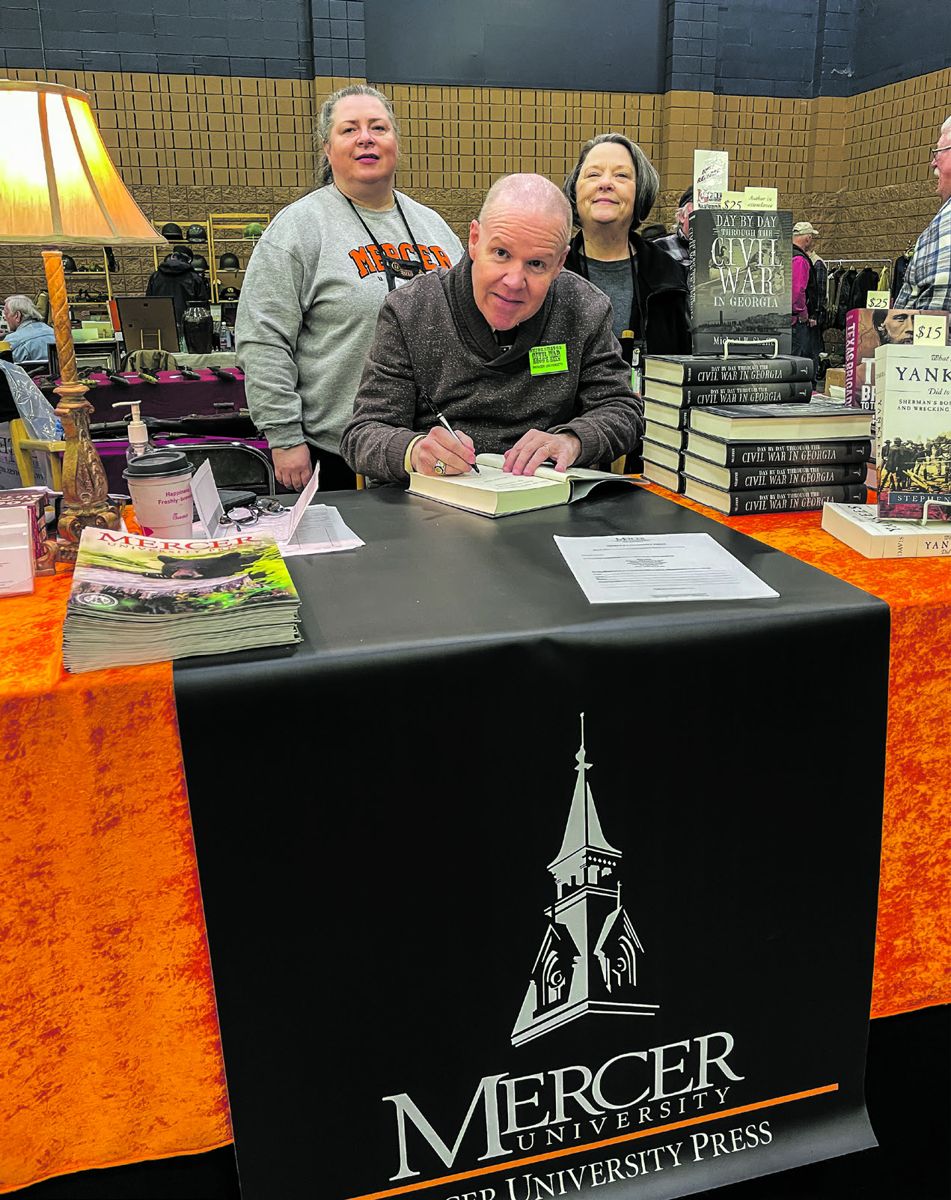 Michael K. Shaffer autographs his new book, Day by Day through the Civil War in Georgia, published by Mercer University Press. Mercer’s Mary Beth Kosowski and Marsha Luttrell manned the table at the show.