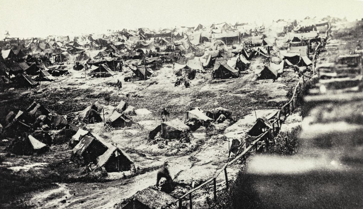 Andersonville Prison, Ga., August 17, 1864. Southwest view of stockade showing the dead-line. (Library of Congress)