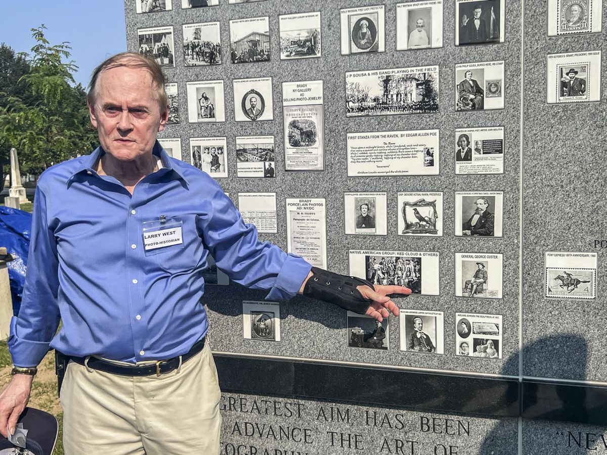 Larry West of Washington, D.C., the creator of the Brady Memorial, points to a photograph of Red Cloud and a delegation of Oglala Lakota who visited Washington after the Civil War.