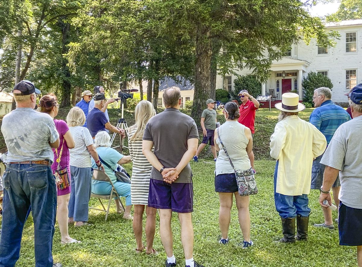 MCWI’s director, in red shirt, leading a new interpretive program at Fort Collier in June. (Photo courtesy Jonathan A. Noyalas)