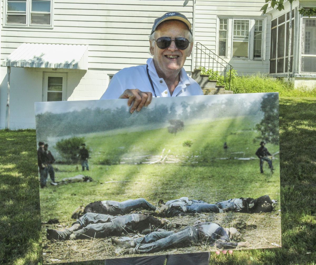 Patrick Brennan with colorized “Harvest of Death” photo.