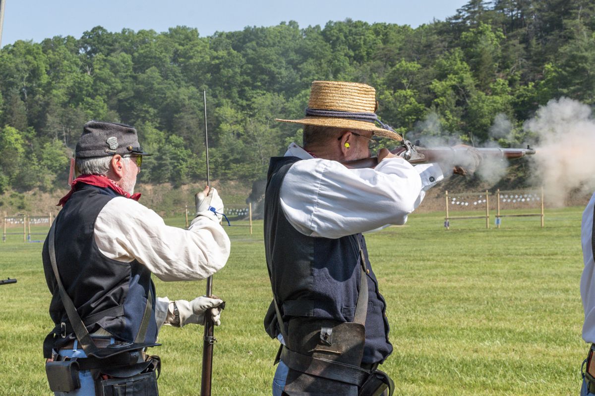 Chris DeFrancisci carefully loads his rifle musket while Skip Fisher fires at four-inch hanging tiles. Their team, the Washington Blue Rifles, had a successful National Skirmish, winning first place 'A' team in the musket match, another gold medal in the single-shot rifle match, and medals in three other small arms team matches. (Ericka Curley)