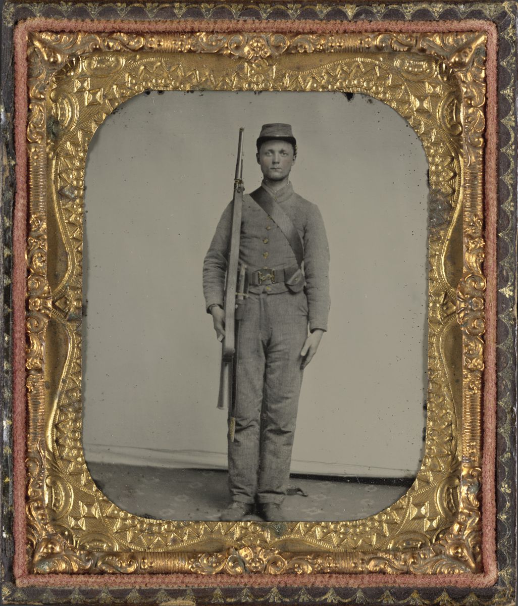 Confederate soldier wearing an English snake belt buckle and accoutrements with Enfield rifle and saber bayonet. Note the oddly angled cap pouch. Liljenquist Family Collection of Civil War Photographs (Library of Congress).
