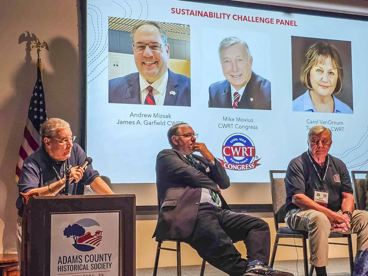 Moderator Dr. John Bamberl with Andrew Mizsak, and Mike Movis.