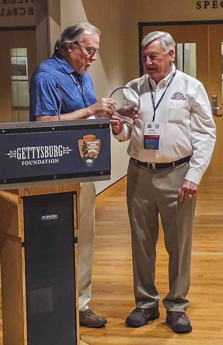 Award presentation. On the right is Mike Movis with CWRT Congress award.