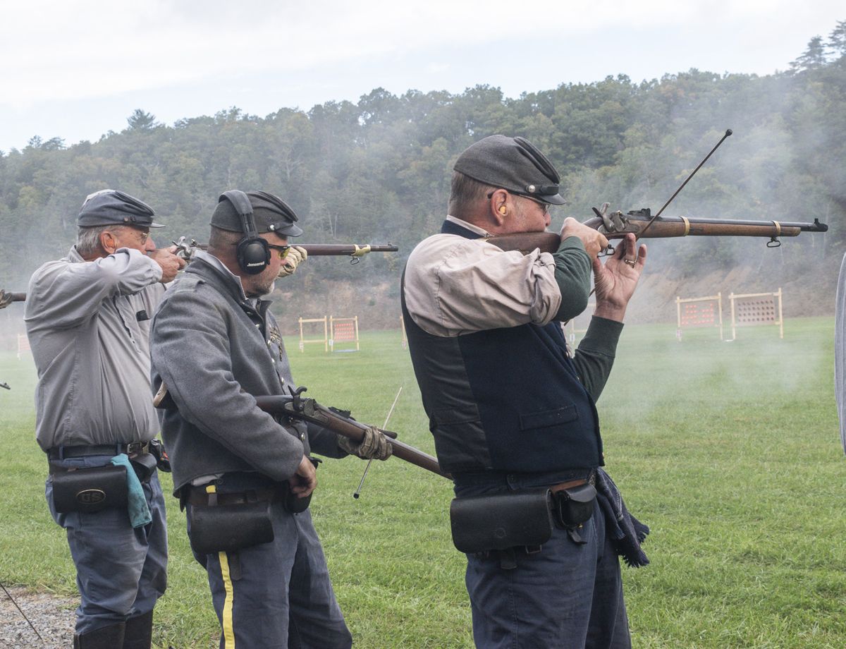 The 9th Virginia Cavalry, CSA was one of 152 musket teams who competed in this National rifle musket match. Two team members skillfully aim their muskets while a third retrieves a percussion cap from his belt pouch to place on his gun. (Ericka Curley)