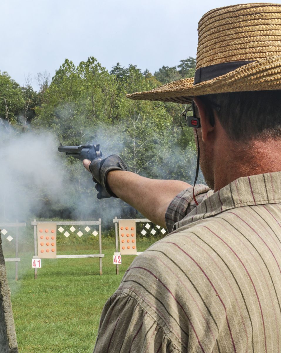 This skirmisher fires his Rogers & Spencer revolver with a cloud of black powder smoke in the opening shot of the revolver company match. (Niki Bethke)