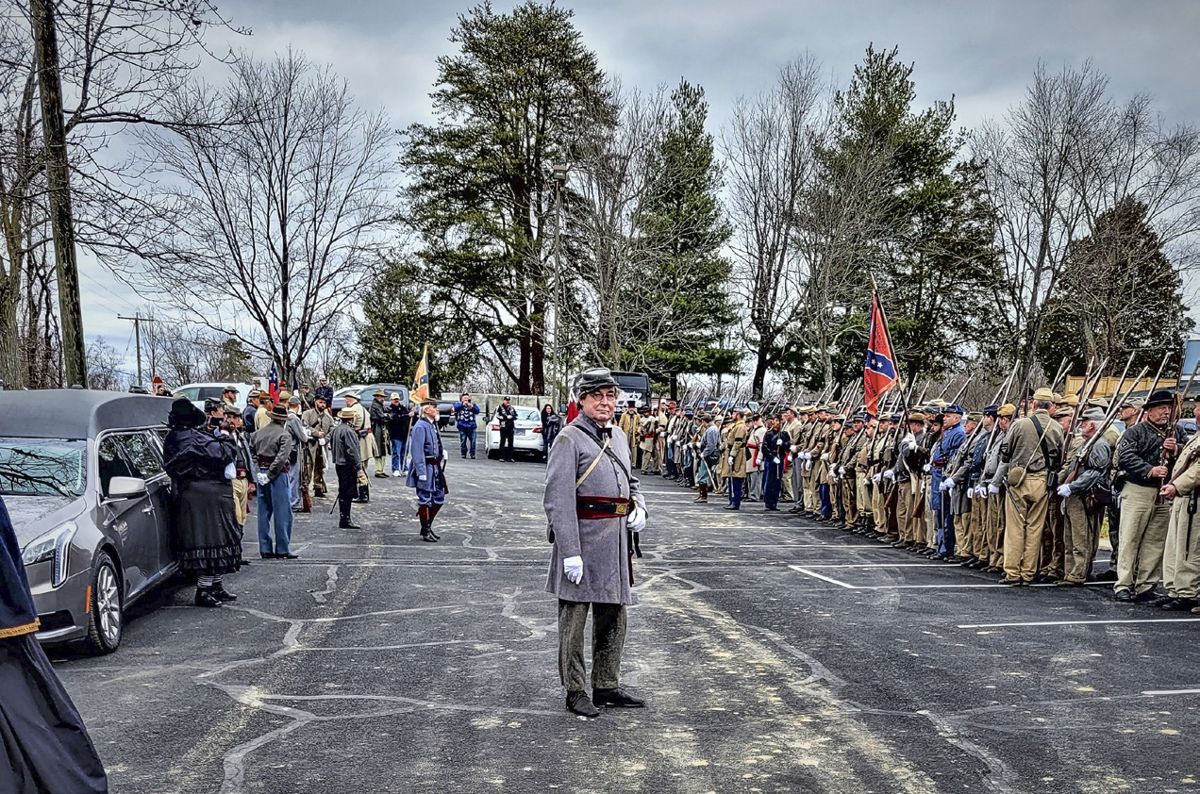 Civil War News contributor Marc Ramsey (center) in front of the Honor Guards at the ceremony.