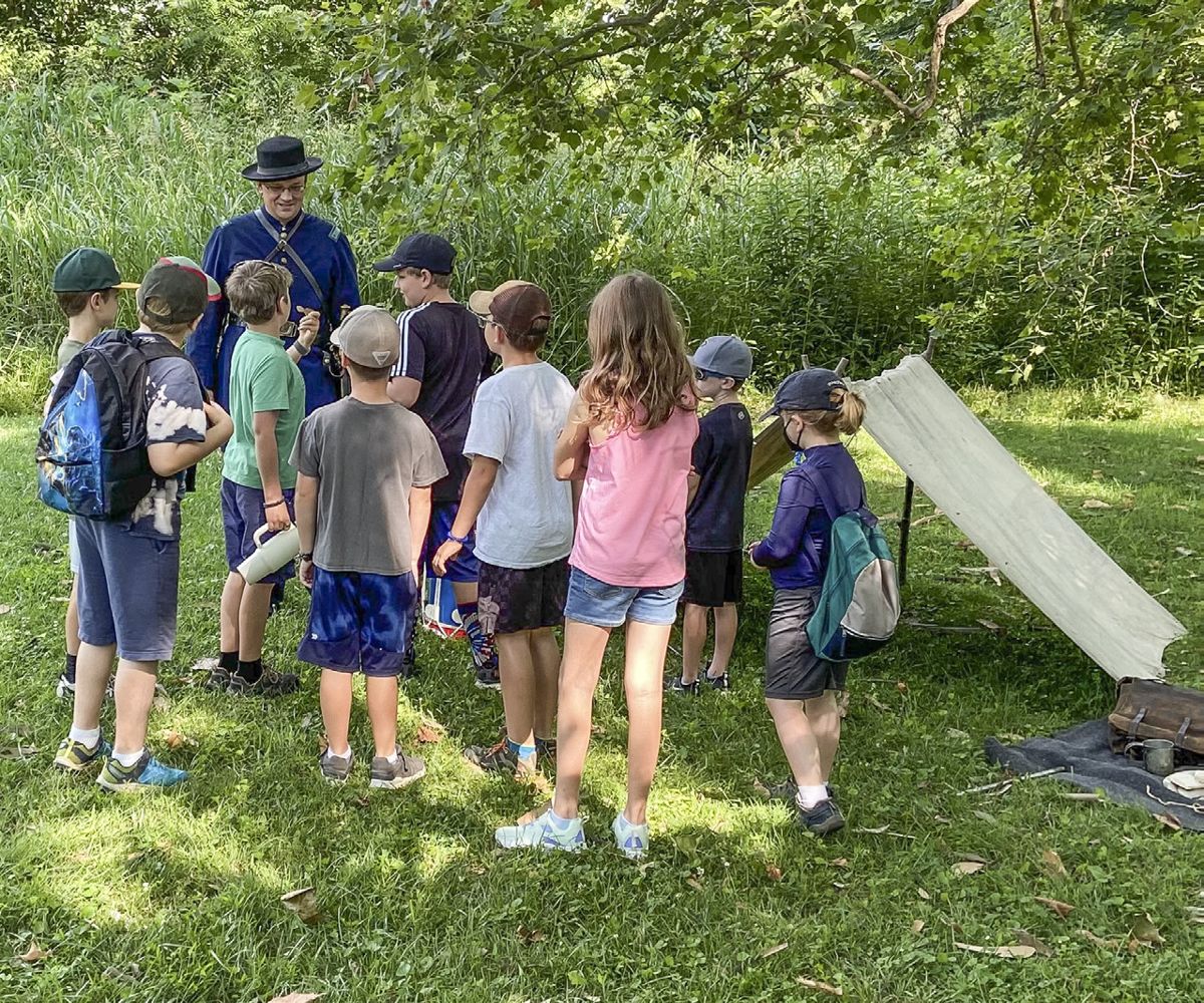 MCWI’s director Jonathan Noyalas, portraying an officer in the 18th Connecticut Infantry, with a group of young historians at Cool Spring.