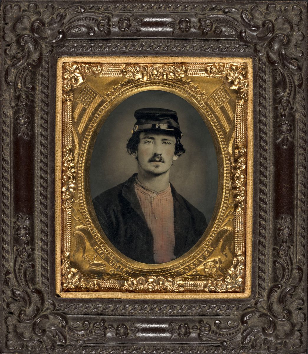 This image shows a Union soldier wearing a forage cap and hand tinted red checked shirt under his 4 button sack coat. Liljenquist Family Collection (Library of Congress)