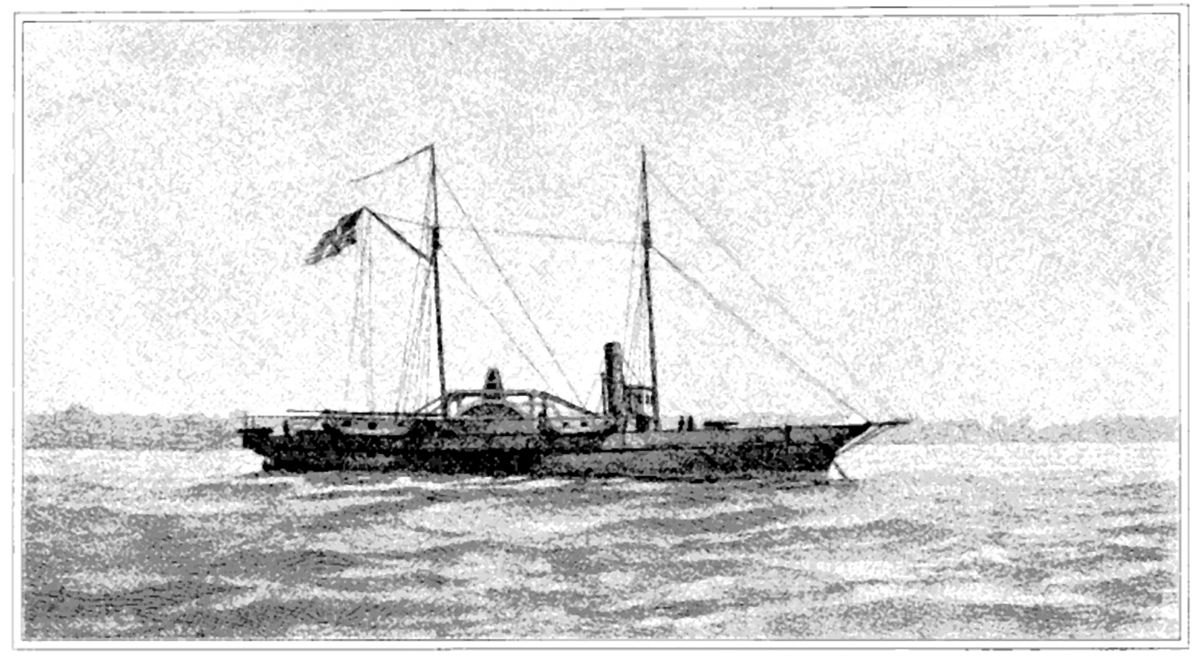 Black and white image of USS Hetzel from a watercolor painting. She lies at anchor, her clipper bow to the right. She carries two masts; a large American flag flies from the gaff of the after (main) mast. The starboard sidewheel is a little aft of directly midship. The single stack is about equally far forward. Superstructure includes a pilot house forward of the stack, some parts of the engines, and a row of cabins aft of the stack. One gun is mounted on the main deck forward, and another is at the stern.”