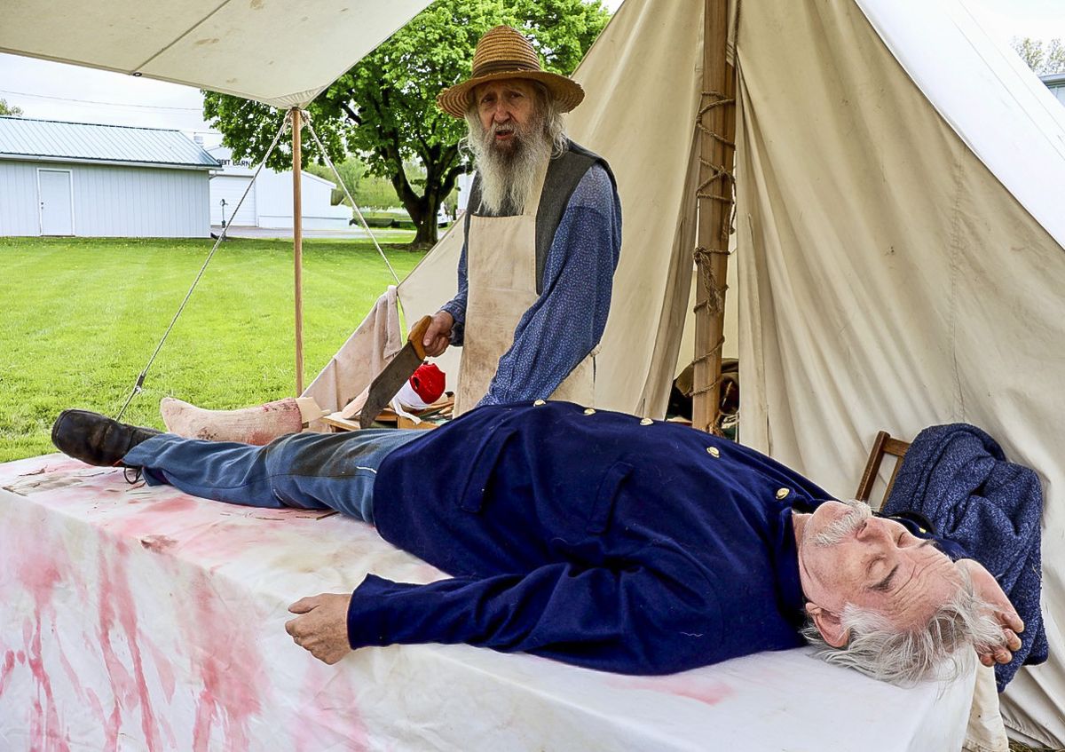 Dr. Doug Gill and Dr. Ralph Reiher perform a Civil War hospital scenario.