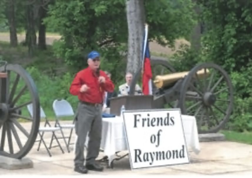 BGES member Parker Hills kicks off the field dedication at Raymond, Miss.