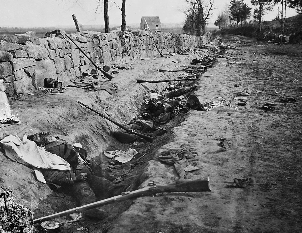 Few period photographs better capture the volume of post-battle debris than this view behind the stone wall at Marye’s Heights after the Second Battle of Fredericksburg. Soldier equipment lies scattered across the ground.