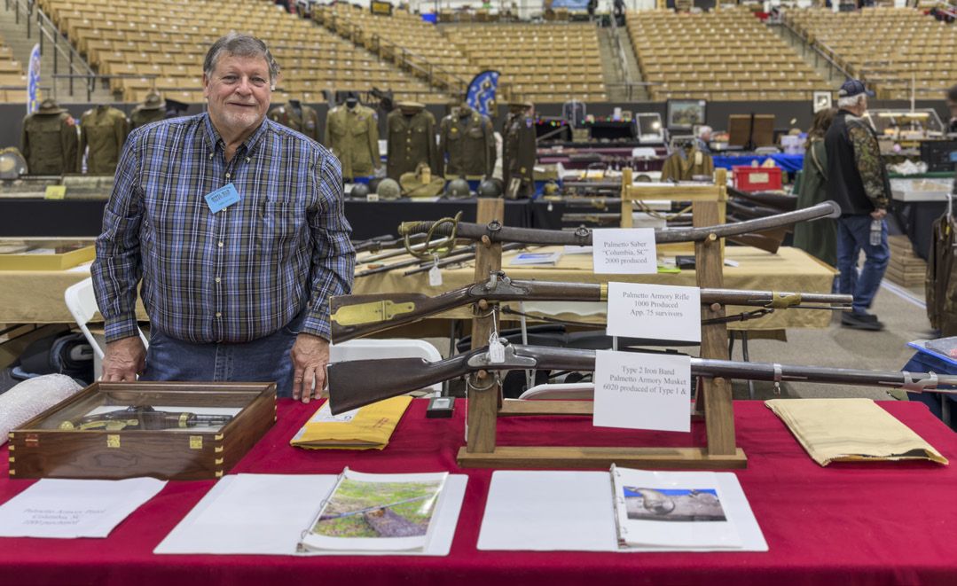 Mike Dyches and his display of Palmetto Armory weapons.