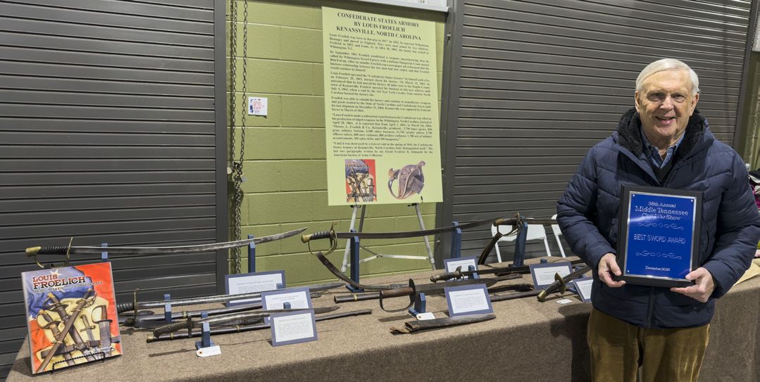 North Carolina native Michael Briggs with his Kenansville Armory sword display.