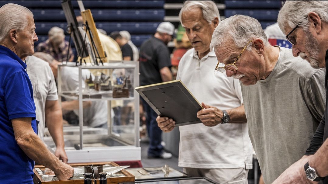 Visitors examined display cases and spoke directly with experienced collectors and dealers.