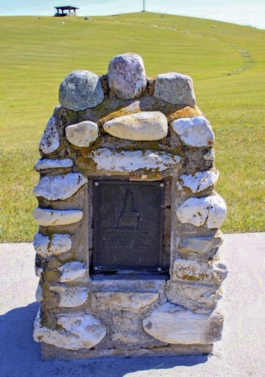 Rock cairn memorial with small plaque dedicated to the native men, women, and children killed at Whitestone Hill, Dickey County, North Dakota. (Brigid Tennant photo)