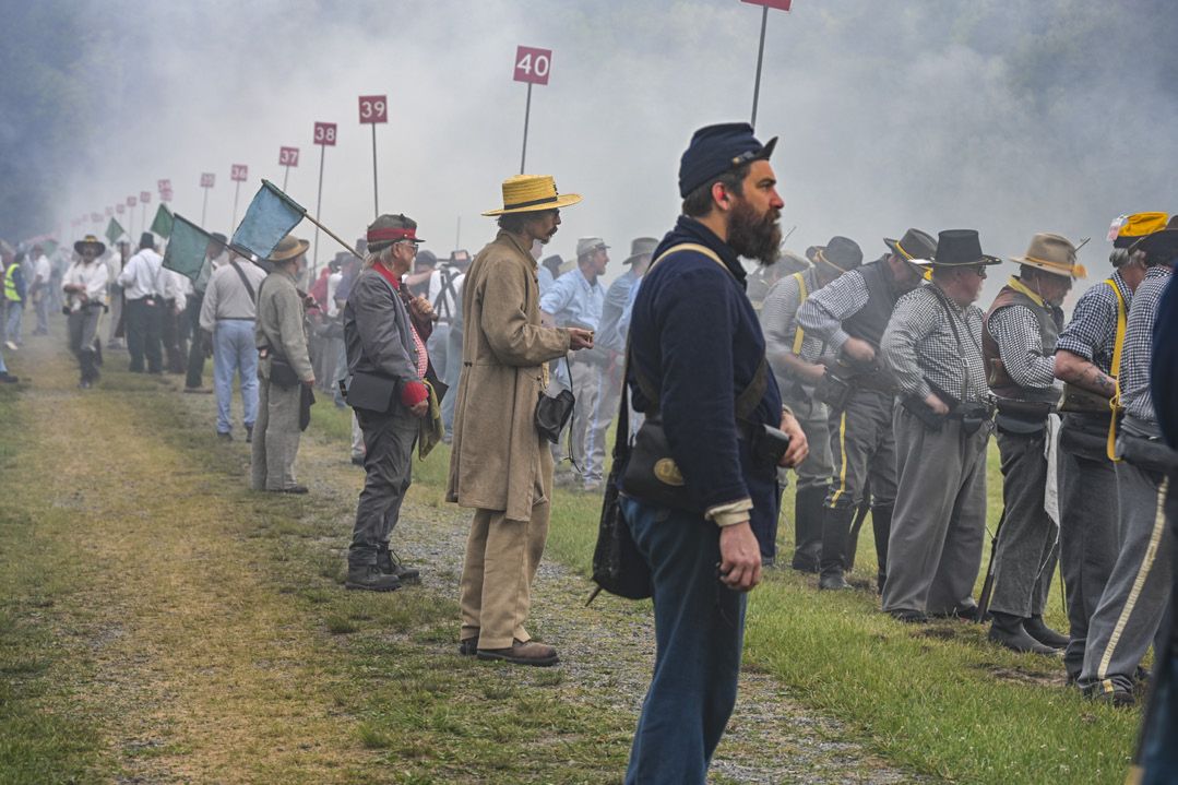 Hundreds of shooters’ black-powder firearms create a great deal of smoke, particularly when it is raining or humid. This atmosphere makes the challenge of accurate shooting even greater. (Lis Cole) Title page.