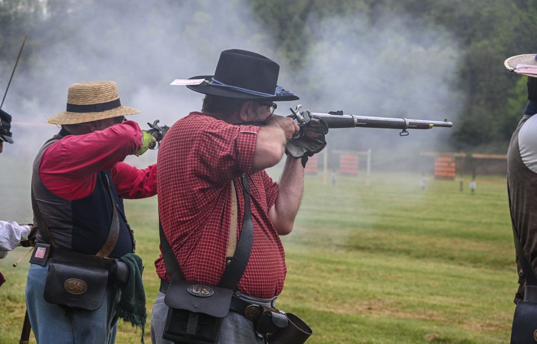 National Commander Dave Cole of the 12th Pennsylvania Reserve Volunteers fires his Model 1855 Rifle during the musket match. His team won third-place medals in its class of 31 competitors.